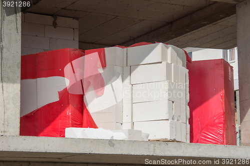 Image of  Masonry blocks lie on the ceiling under construction house