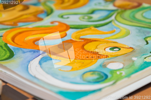 Image of Detail graphic image of goldfish painted in watercolor album