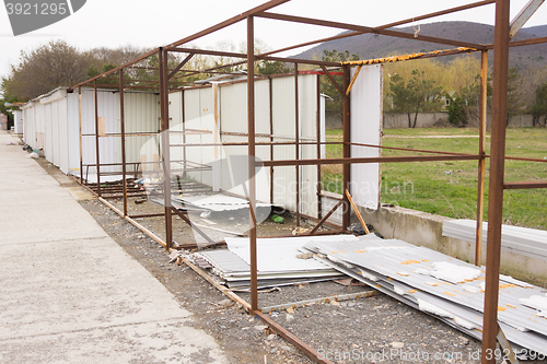 Image of Metal structures dismantled metal stalls are near metal sheets