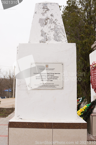Image of Sukko, Russia - March 15, 2016: Information sign on a communal grave of Soviet soldiers and civilians in the village of Sukko, who died fighting Nazi invaders and state in the 1942-1943 year