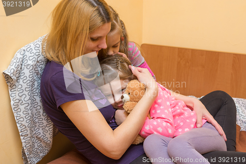 Image of My mother and older sister comforted the little girl