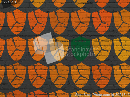 Image of Privacy concept: shield icon on wall background