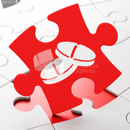 Image of Healthcare concept: Pills on puzzle background