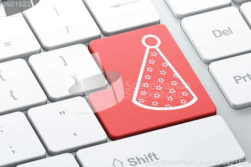 Image of Holiday concept: Party Hat on computer keyboard background