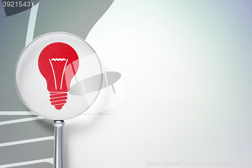 Image of Business concept:  Light Bulb with optical glass on digital background