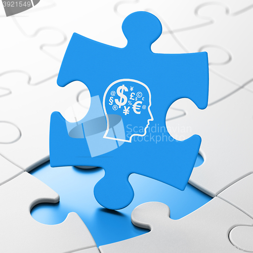 Image of Education concept: Head With Finance Symbol on puzzle background