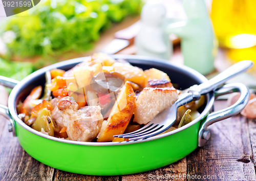 Image of fried meat with vegetables