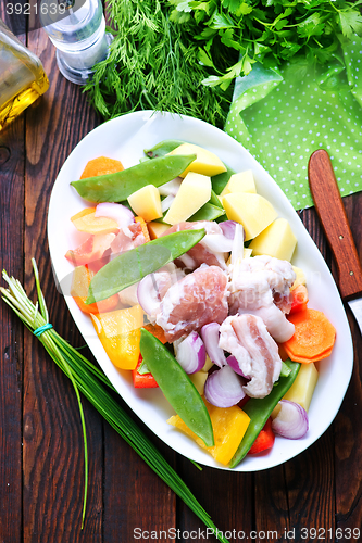 Image of raw meat with vegetables