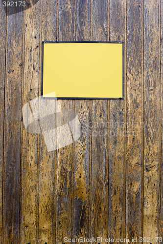 Image of Grungy wood texture with a yellow sign for background