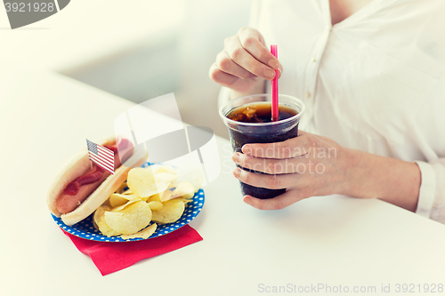 Image of close up of woman drinking cola