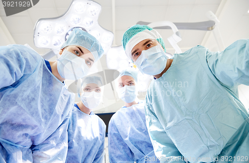 Image of group of surgeons in operating room at hospital