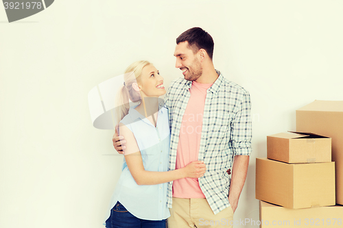 Image of couple with cardboard boxes moving to new home