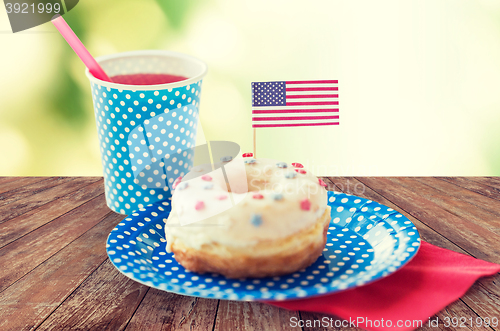 Image of donut with juice and american flag decoration