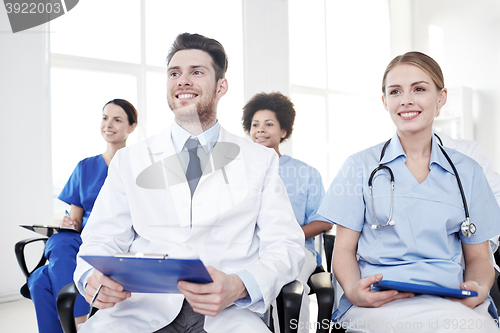 Image of group of happy doctors on seminar at hospital