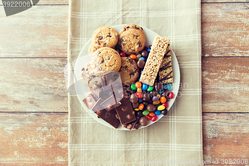 Image of close up of candies, chocolate, muesli and cookies