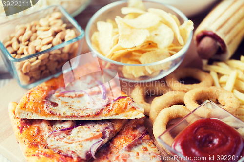 Image of close up of fast food snacks on wooden table