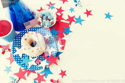 Image of donut with juice and candies on independence day