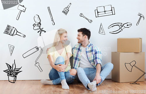 Image of couple with cardboard boxes moving to new home