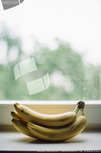 Image of bunch of bananas on the window