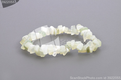 Image of Splintered jade chain on gray background