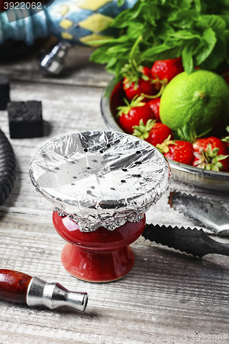 Image of Hookah bowl with tobacco