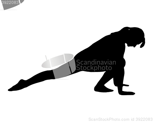 Image of Silhouette of woman doing yoga