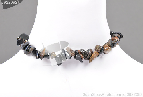 Image of Splintered tigers and hawks eye chain on bust
