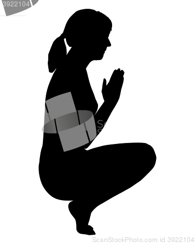 Image of Silhouette of woman doing yoga