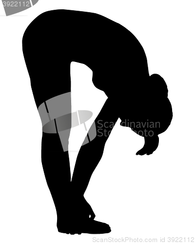 Image of Silhouette of woman doing yoga