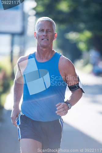 Image of handsome senior man  jogging