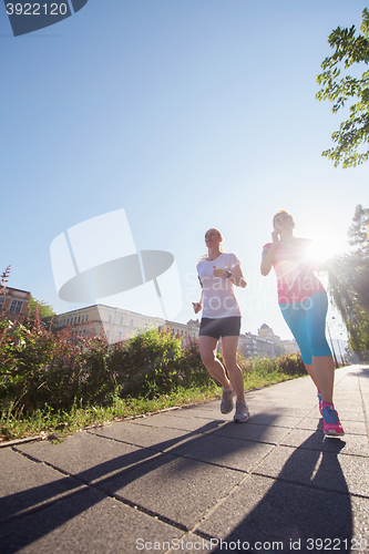 Image of female friends jogging