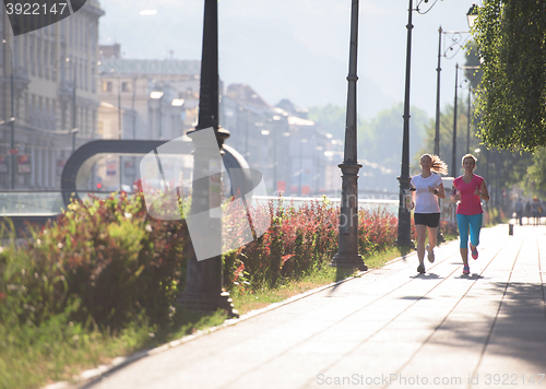 Image of female friends jogging