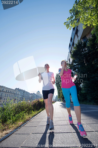 Image of female friends jogging