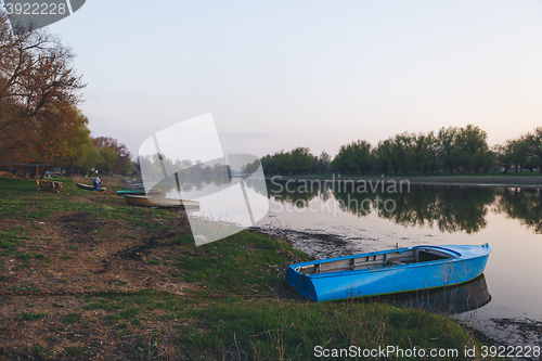 Image of the boat was moored to the banks of the river