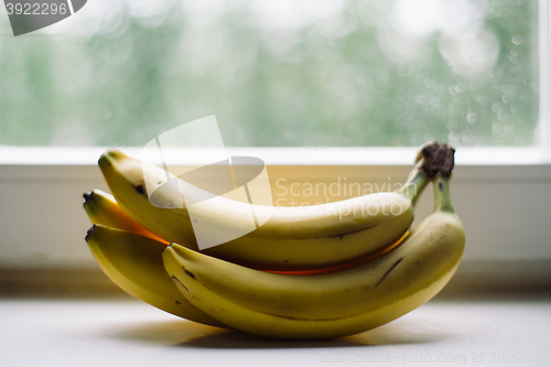 Image of bunch of bananas on the window