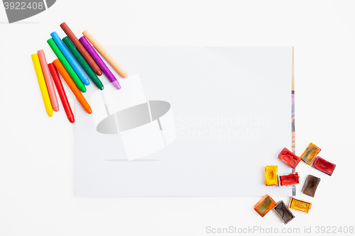 Image of Colour pencils and watercolor  on paper blank isolated 