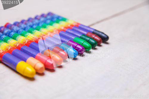 Image of wax crayons on wood table