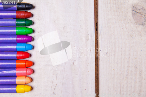 Image of wax crayons on wood table