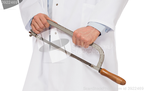 Image of Crazy doctor is holding a big saw in his hands