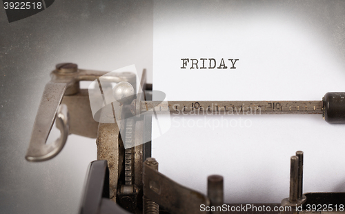 Image of Friday typography on a vintage typewriter