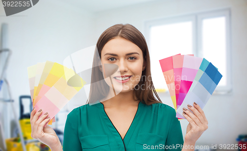 Image of smiling young woman with color swatches