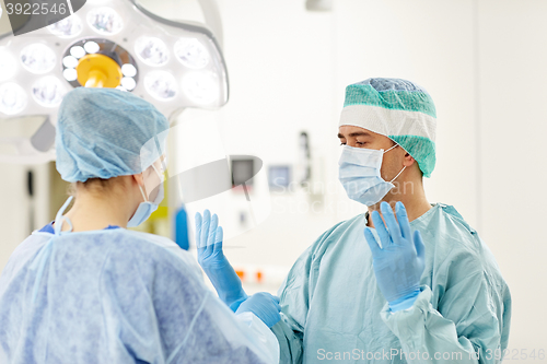 Image of surgeons in operating room at hospital