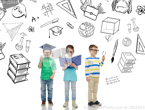 Image of kids in glasses with book, lens and bachelor hat