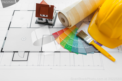 Image of close up of house blueprint with building tools