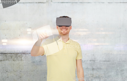 Image of happy man in virtual reality headset or 3d glasses