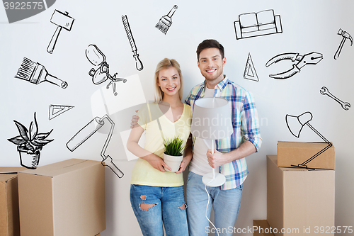 Image of happy couple with stuff moving to new home