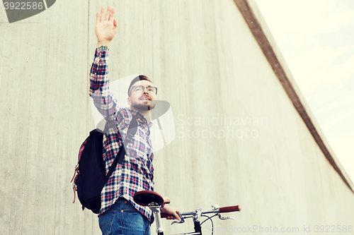 Image of hipster man with fixed gear bike and backpack