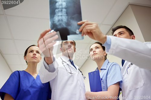 Image of group of doctors looking at x-ray scan image