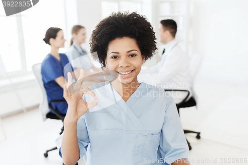 Image of doctor or nurse showing ok hand sign at hospital