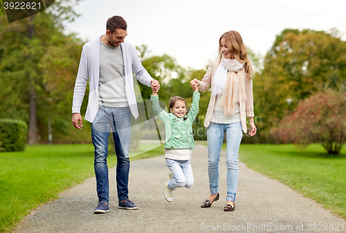 Image of happy family walking in summer park and having fun